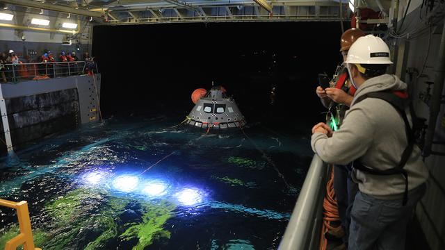 NASA image: Orion Hoisted into the Well Deck
